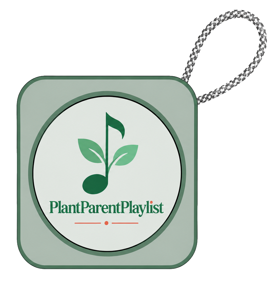 The PlantParentPlaylist Bluetooth speaker in sage green, with the brand logo on the front and a woven carry strap