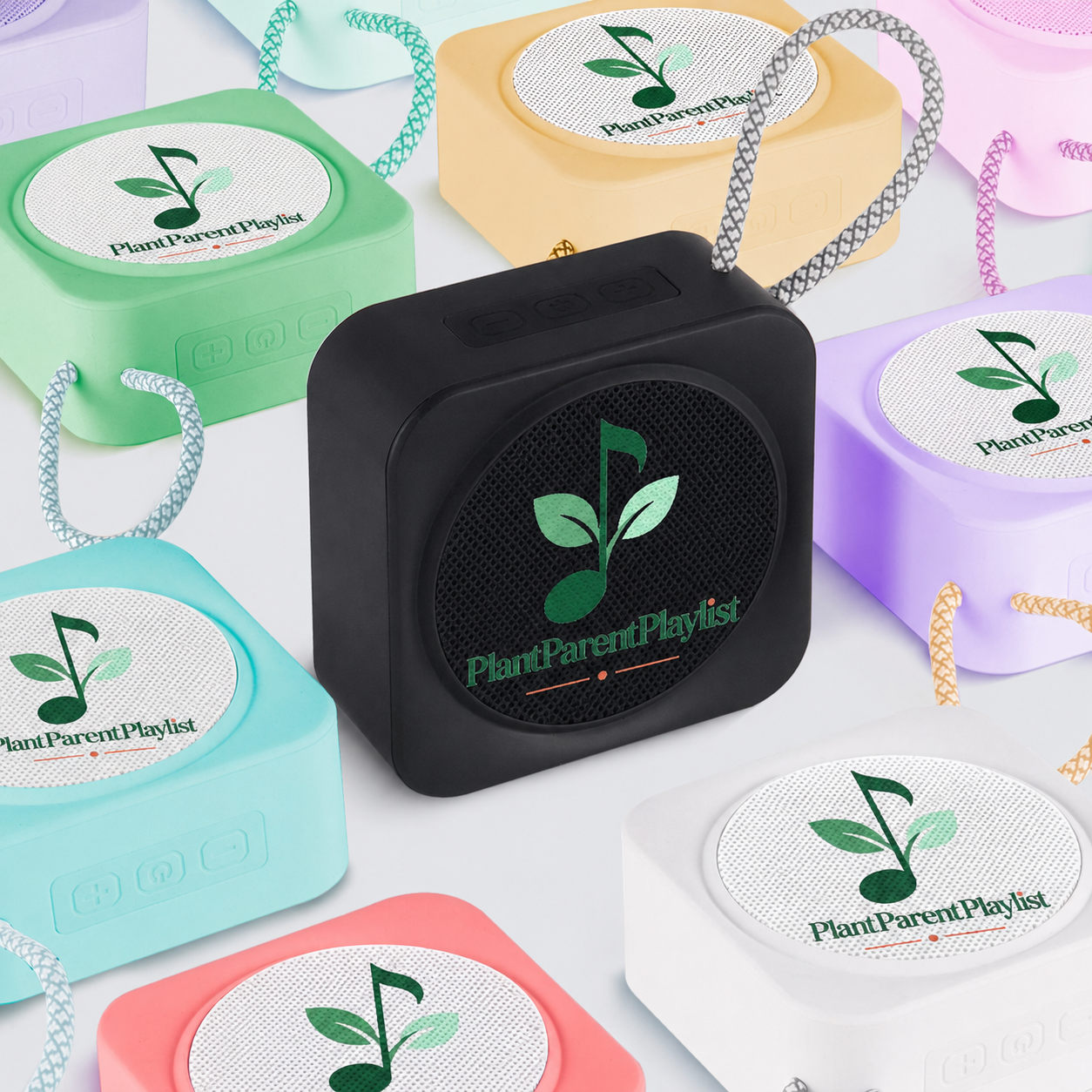 The PlantParentPlaylist Bluetooth speaker, shown in terracotta, sage green, bone white and other colorways